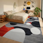 Red Orange Black White Circles Contemporary Rug - Bedroom View